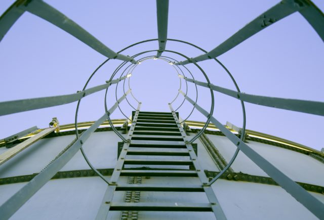 Point of view shot of metal stairs leading up a water tank